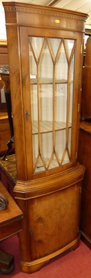 Lot 1177 - A contemporary yew wood freestanding corner...