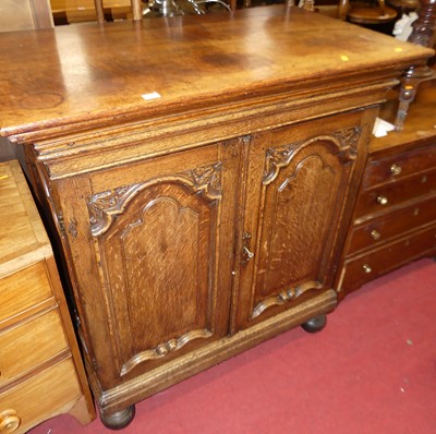 Lot 1183 - An early 20th century joined oak double door...