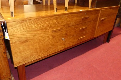 Lot 1214 - A walnut long sideboard having three central...
