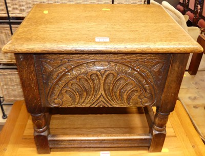 Lot 1219 - A small oak hinge top work stool, width 45.5cm