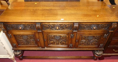 Lot 1200 - A joined and floral low relief carved oak...