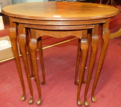 Lot 1203 - A beech and walnut oval nest of three...