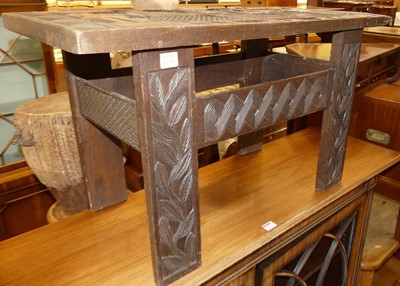 Lot 1231 - A continental relief carved hardwood...