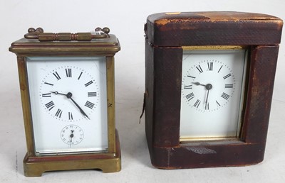 Lot 464 - Two similar brass carriage timepieces, one...