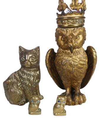 Lot 461 - A heavy gilded metal model of an owl; together...