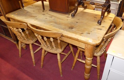 Lot 1235 - A pine round cornered farmhouse kitchen table,...