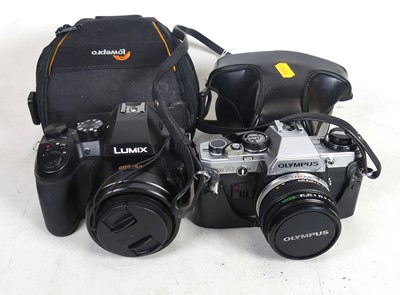 Lot 468 - An Olympus OM10 manual wind camera; together...