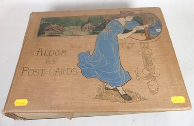 Lot 475 - An extensive Edwardian postcard album and...