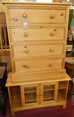 Lot 1242 - A contemporary pine chest of four long drawers,...