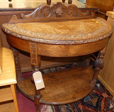 Lot 1244 - An early 20th century floral relief carved oak...