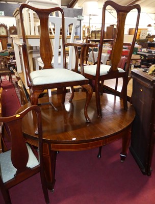 Lot 1254 - An early 20th century mahogany oval extending...