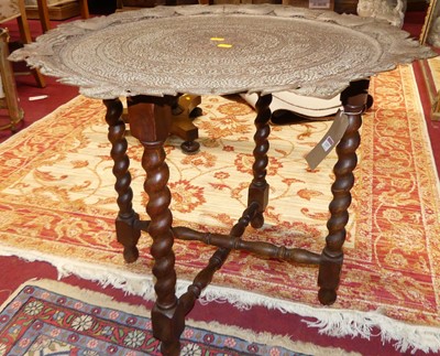 Lot 1257 - An engraved brass shaped top benares table,...
