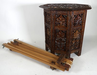 Lot 594 - An artist's easel together with a carved...