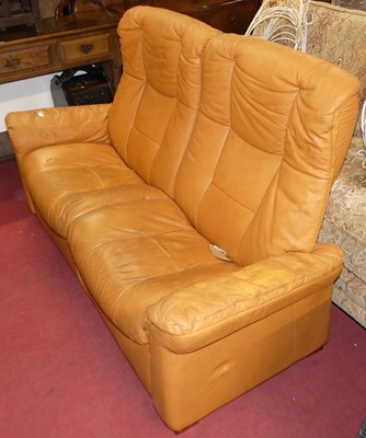 Lot 1272 - A contemporary tan leather two-seater...