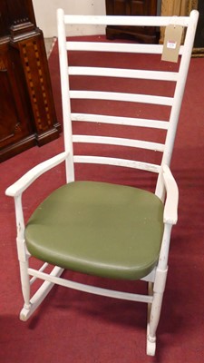 Lot 1276 - A white painted ladderback rocking elbow chair,...