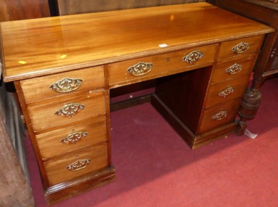 Lot 1308 - An Edwardian mahogany kneehole writing desk,...