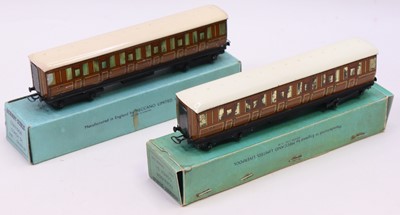 Lot 234 - Two Hornby Dublo pre-war D1 coaches, in teak,...
