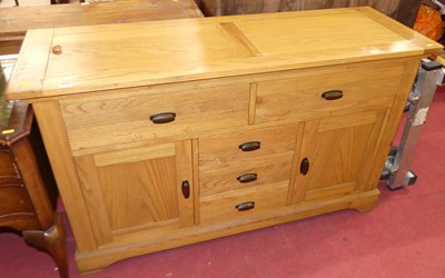 Lot 1318 - A contemporary blond oak sideboard, fitted...