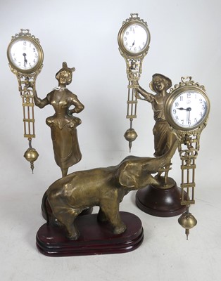 Lot 523 - A pair of continental brass mystery clocks,...