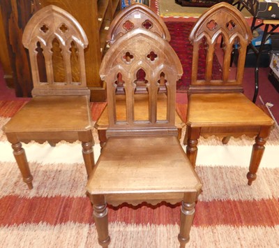 Lot 1344 - A set of four Gothic style oak panelled seat...