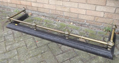 Lot 1351 - A late Victorian brass and iron fire fender