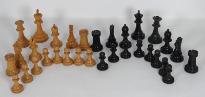 Lot 447 - A boxwood and ebony chess set in the Staunton...