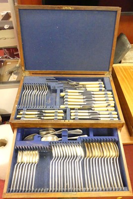 Lot 200 - An oak two-drawer canteen of cutlery, having a...