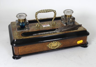 Lot 93 - A Victorian figured Walnut and brass inlaid...