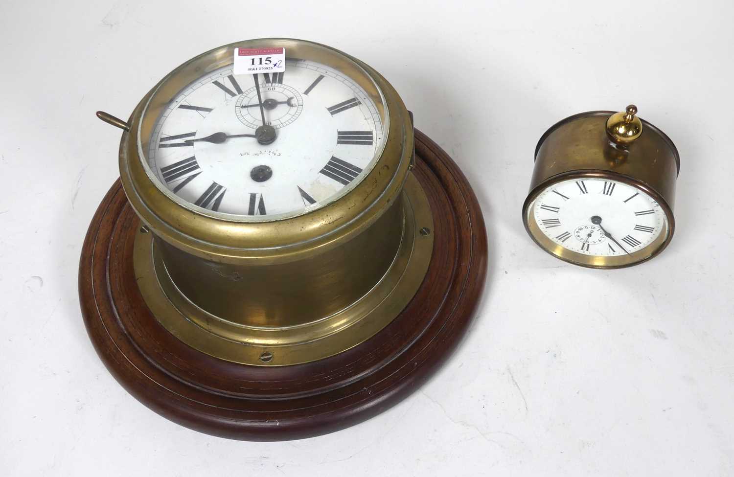 Lot 115 - A bulkhead brass ships clock, having an enamel...