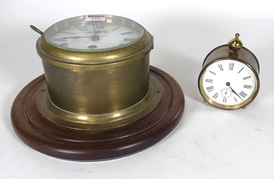 Lot 115 - A bulkhead brass ships clock, having an enamel...
