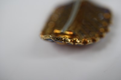 Lot 2651 - A Cartier 18ct gold stylised leaf brooch...