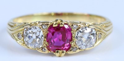 Lot 2749 - A yellow metal ruby and diamond 3 stone ring....