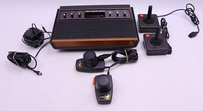 Lot 2025 - Atari Video Game System containing a loose...