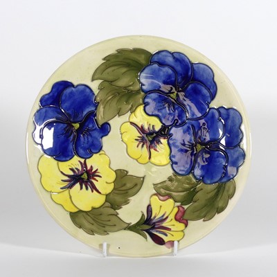 Lot 157 - A Moorcroft pottery 'Pansy' pattern plate,...