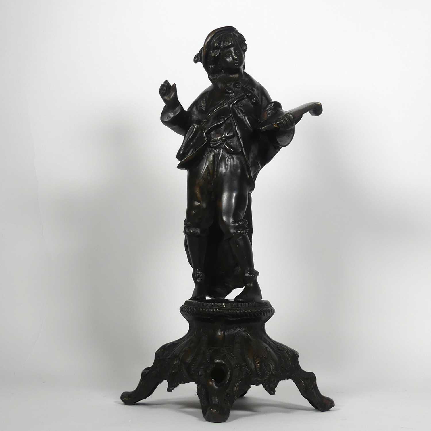 Lot 6 - A bronzed metal figure of a boy as a scribe,...