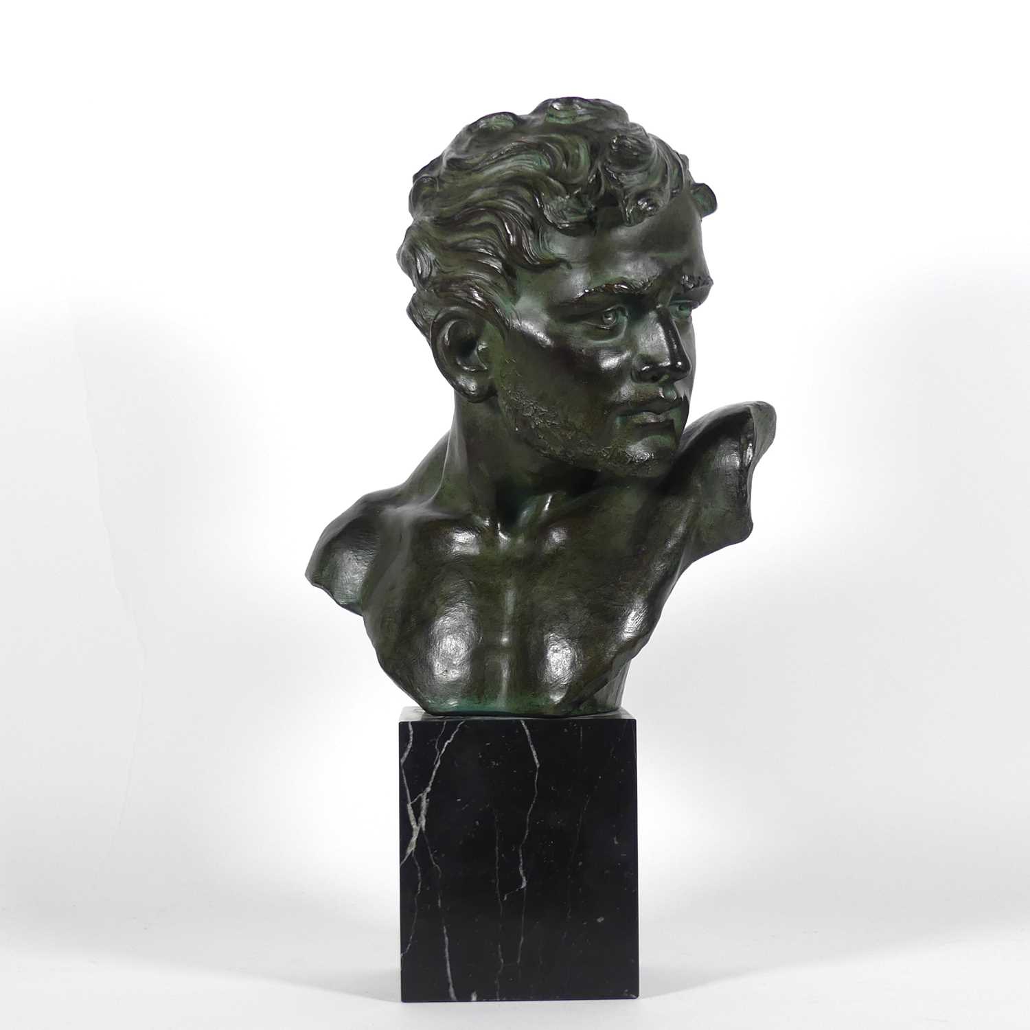 Lot 1 - An Art Deco style bronzed plaster bust of a...