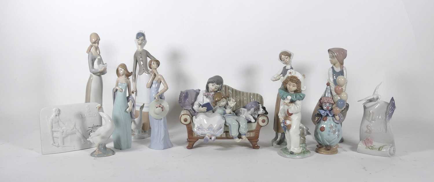 Lot 87 - A collection of nine Lladro figures and...