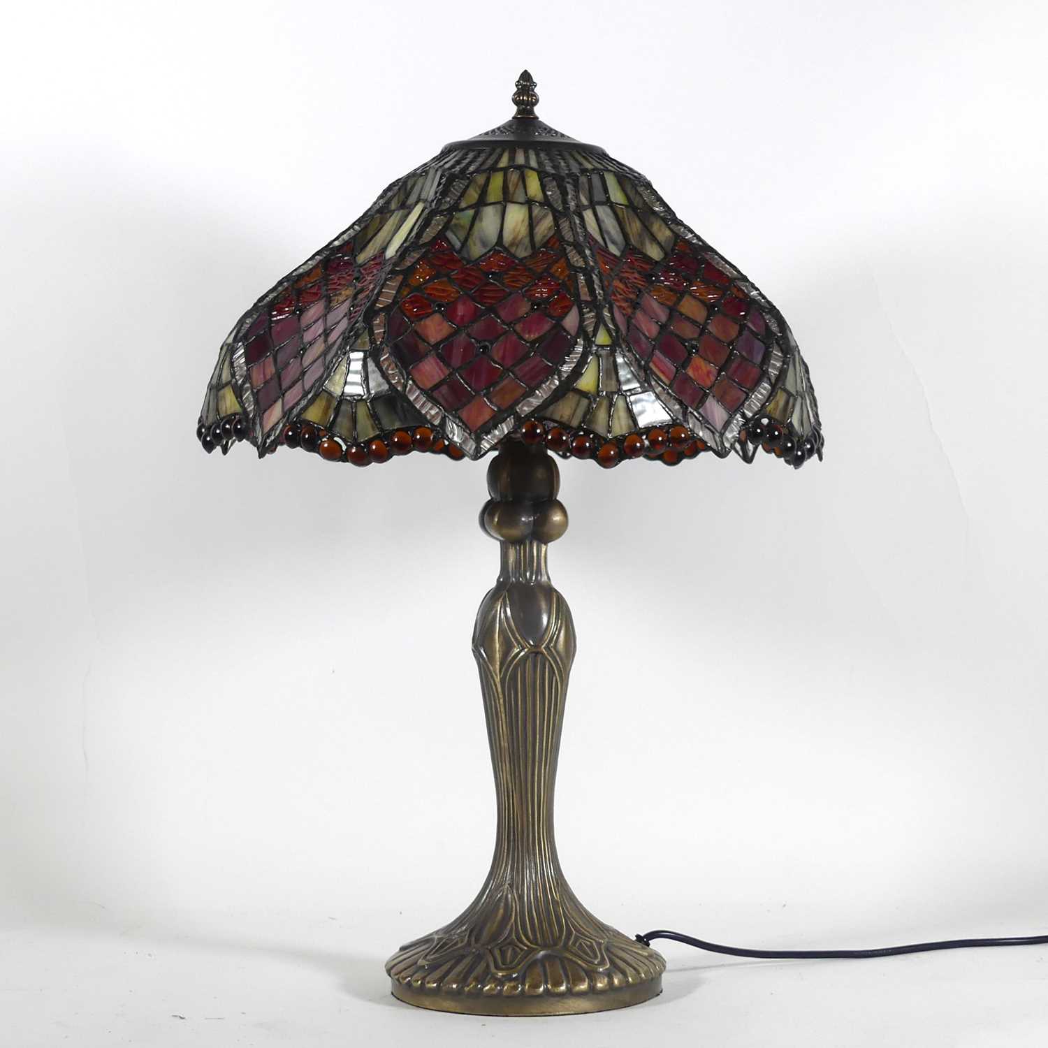 Lot 10 - A Tiffany style table lamp, having a stained...