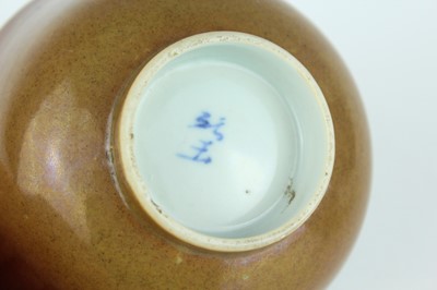 Lot 163 - A pair of Chinese iron-brown glazed and...