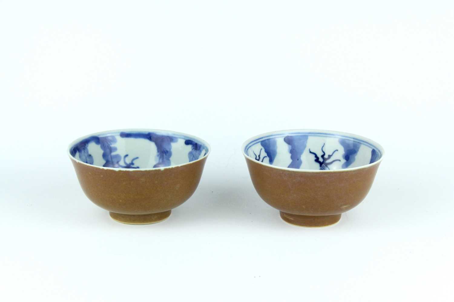 Lot 163 - A pair of Chinese iron-brown glazed and...