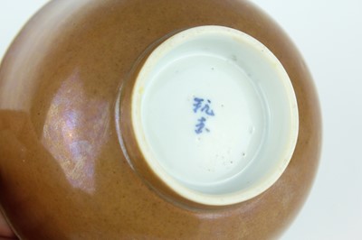 Lot 163 - A pair of Chinese iron-brown glazed and...