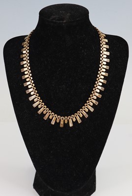 Lot 2660 - A 9ct yellow gold textured articulated fringe...