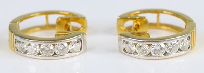 Lot 2664 - A pair of yellow metal diamond hinged huggy...