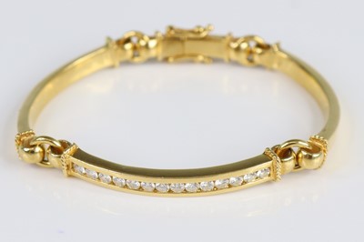 Lot 2665 - A yellow metal diamond curved bar link...