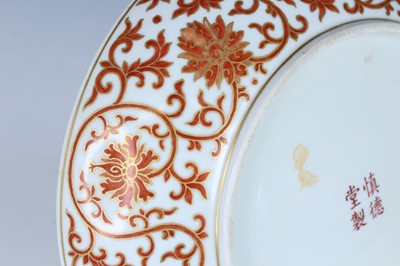 Lot 176 - A Chinese iron-red and gilt decorated dish,...