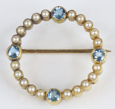Lot 2671 - A yellow metal aquamarine and pearl circular...
