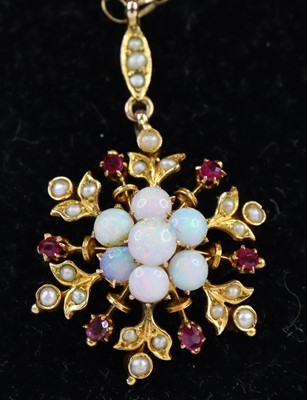 Lot 2656 - A yellow metal opal, ruby and pearl snowflake...
