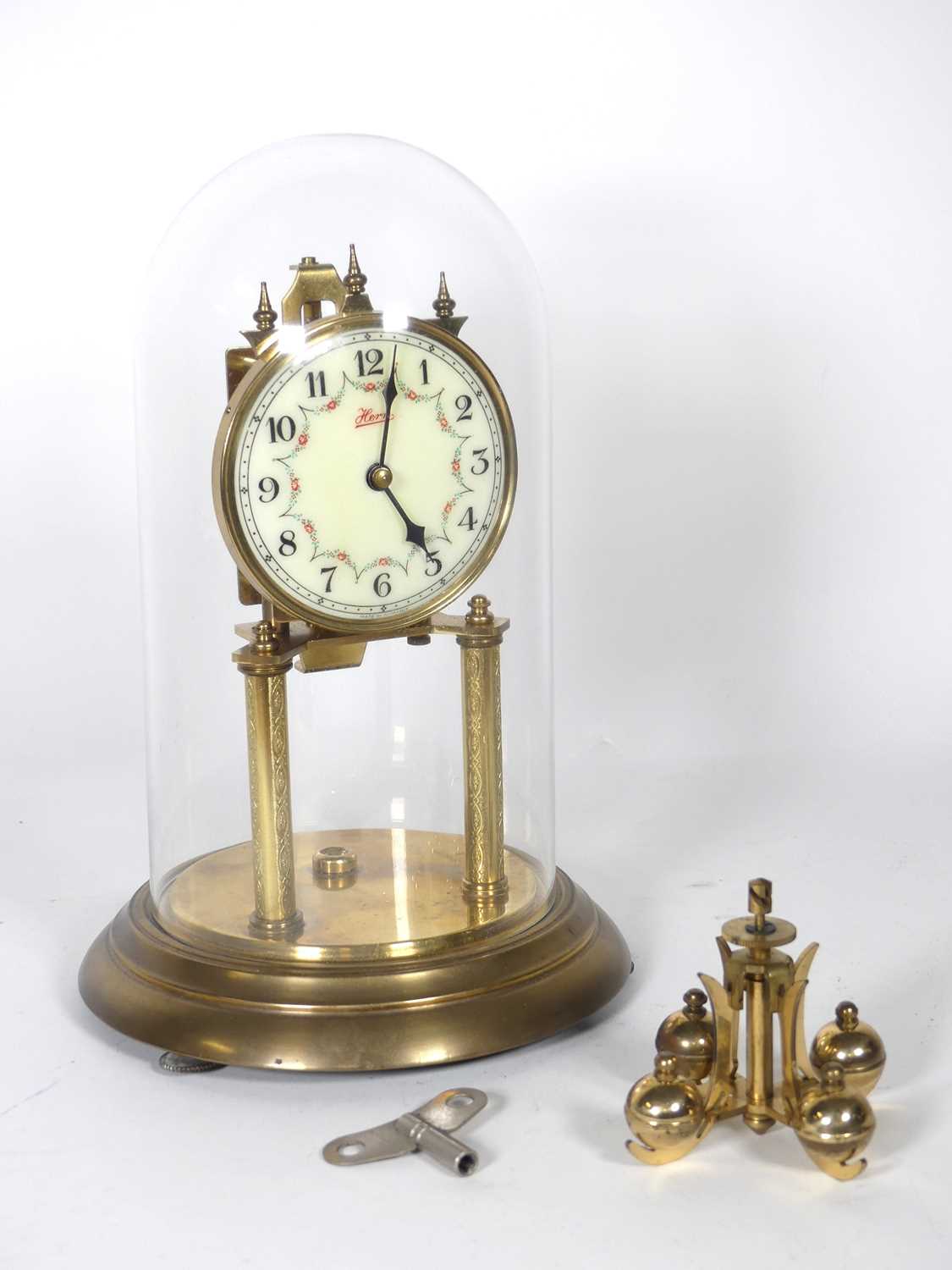 Lot 39 - A German brass anniversary clock, the dial...