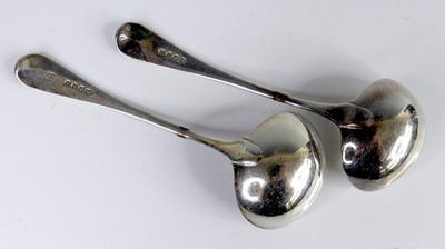Lot 2103 - A pair of George III silver sauce ladles, in...