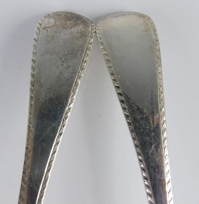 Lot 2103 - A pair of George III silver sauce ladles, in...
